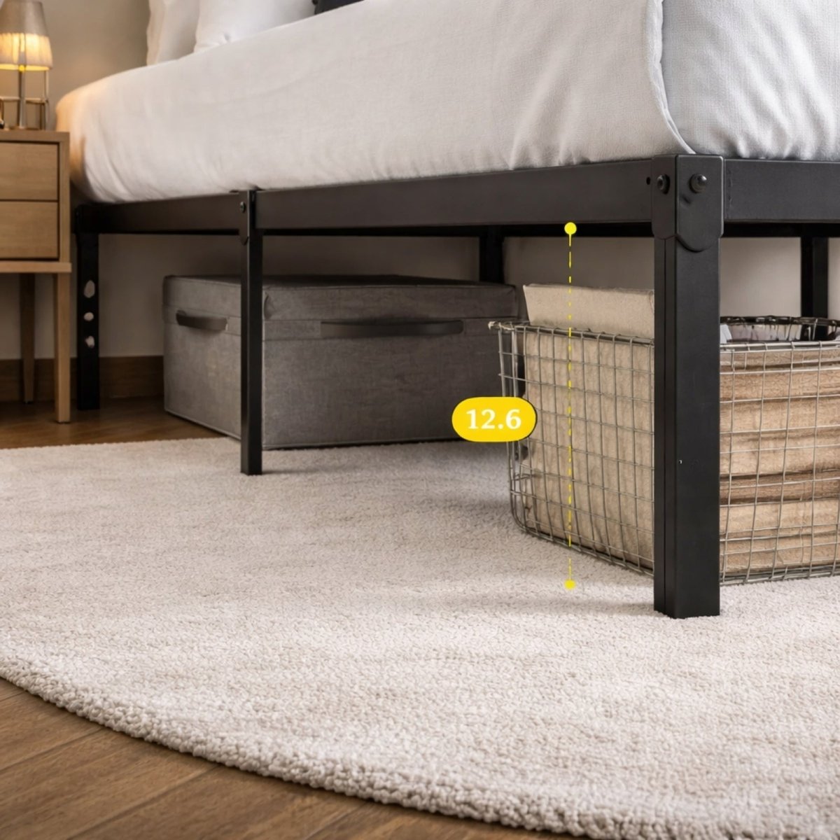 Close-up view of the 12.6-inch under-bed storage clearance on the Kouvr metal platform frame with storage bins underneath.