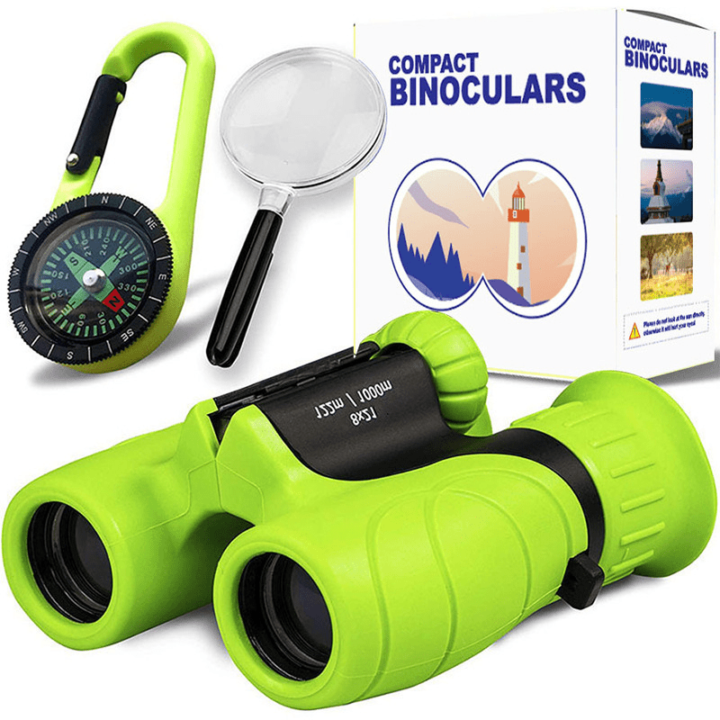 Professional product shot of lime green kids binoculars, matching compass, and magnifying glass set with educational gift box.