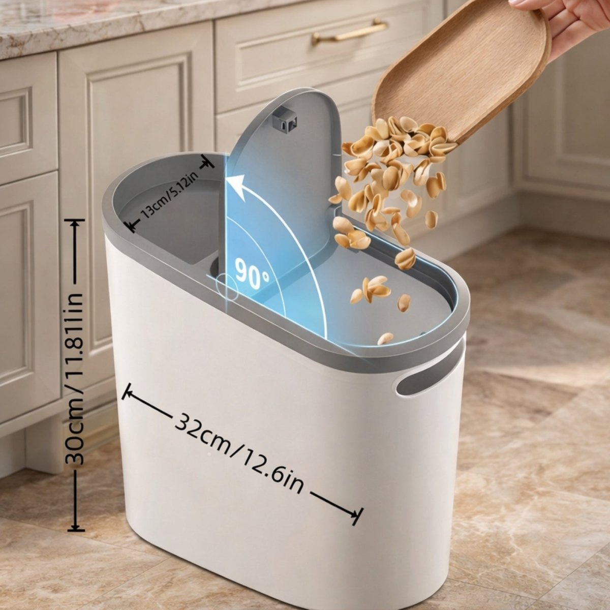 Dimensions of the Kouvr trash can (30cm height, 32cm length, 13cm width) shown while disposing of pistachio shells into the 90-degree open lid.