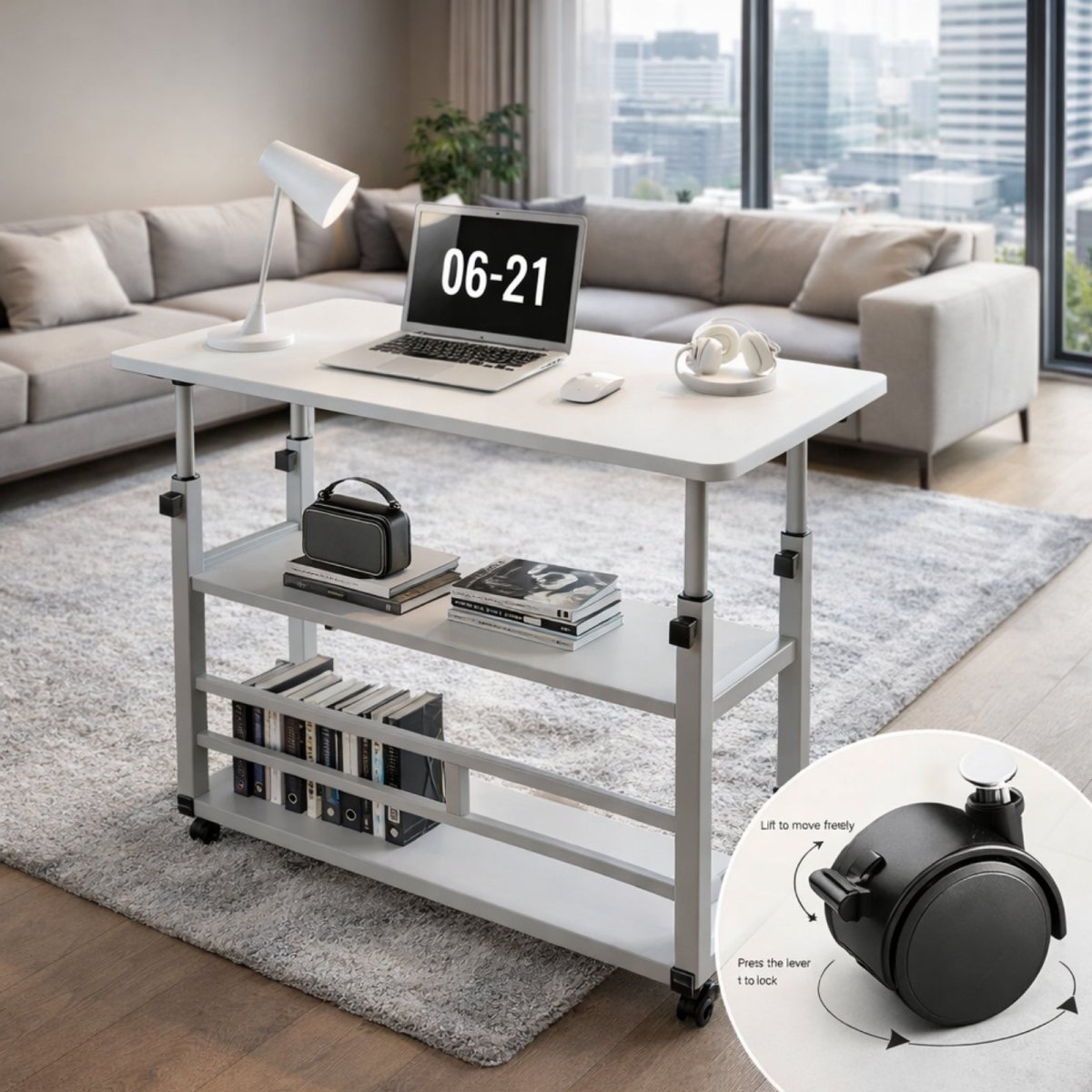 A white adjustable C-table with a laptop on it, positioned over a modern grey sofa in a bright living room, with an inset showing the locking wheel mechanism.