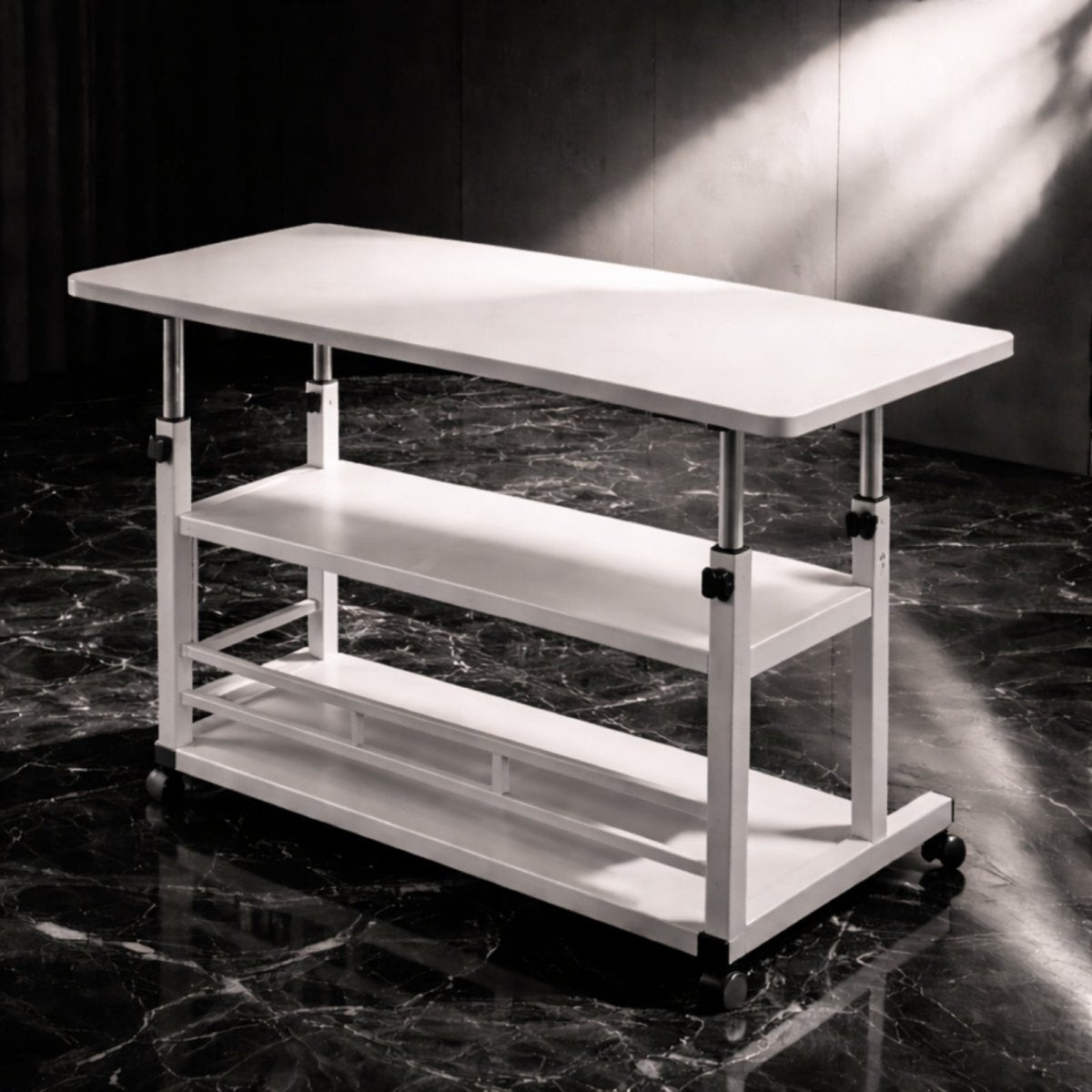 The Kouvr height-adjustable rolling desk in white, shown in a dramatic studio setting with strong lighting to highlight its minimalist form and shelving.