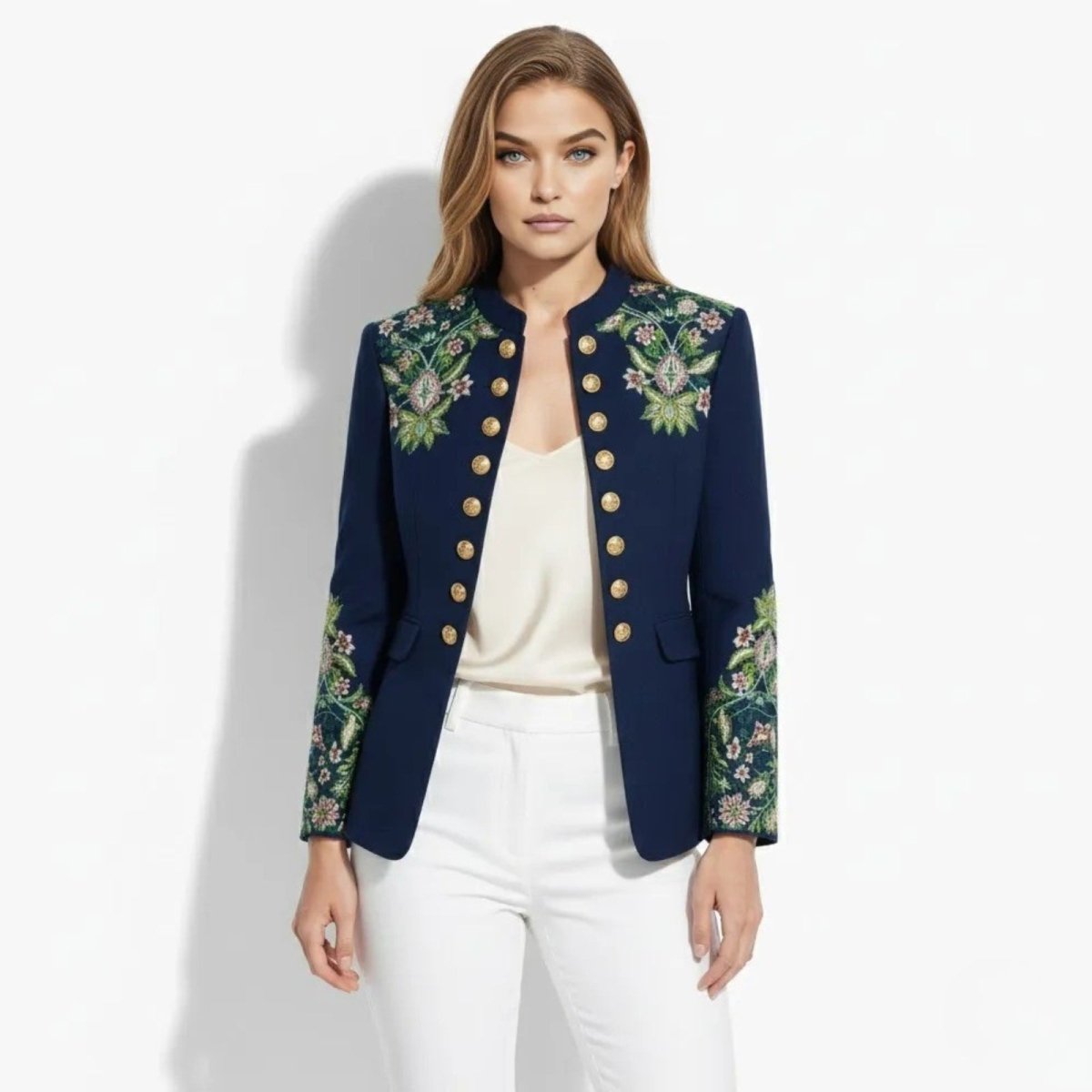 Model wearing the Kouvr Aiko green embroidered military jacket, showing the front view with gold buttons and floral embroidery on the chest.