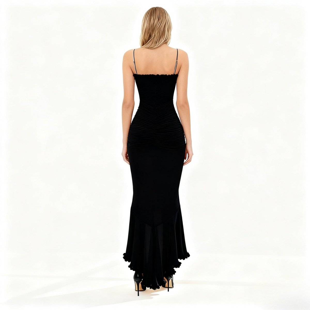 Black evening gown with a fitted bodice and white background