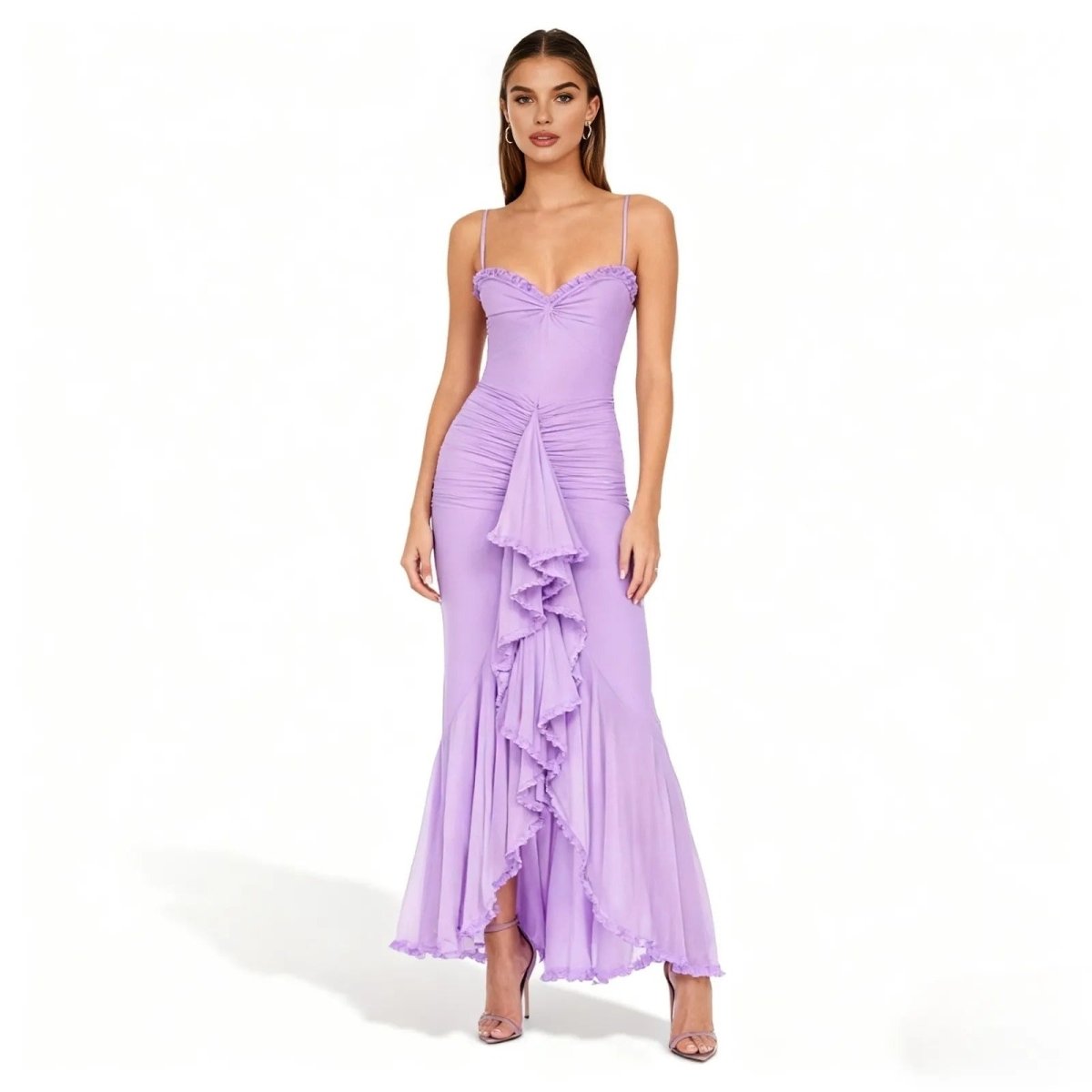 Woman wearing a light purple kouvr evening gown with ruffled details on a white background