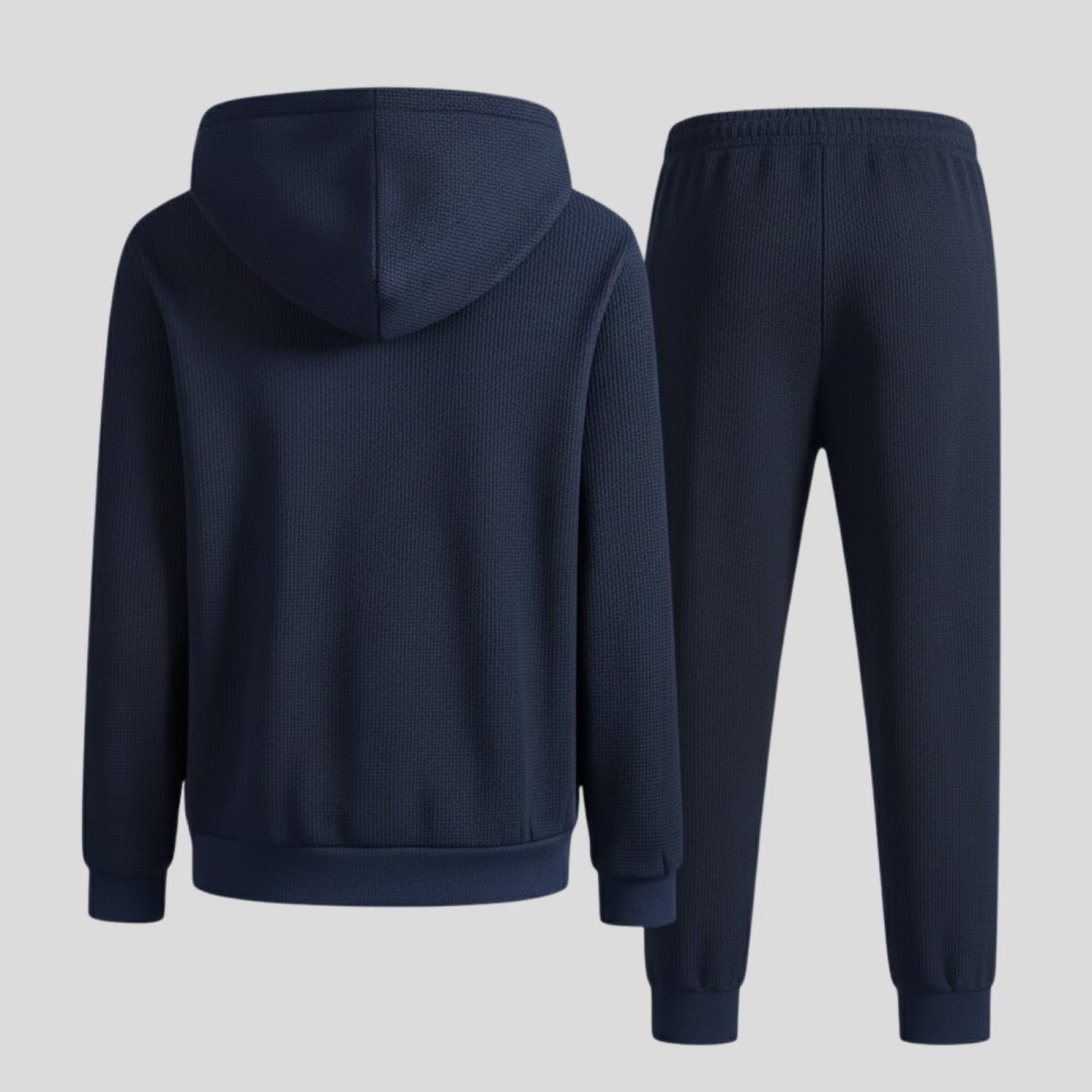 Back view flat lay of the Kouvr blue sweatsuit, detailing the texture of the waffle-knit fabric on the hoodie and joggers.