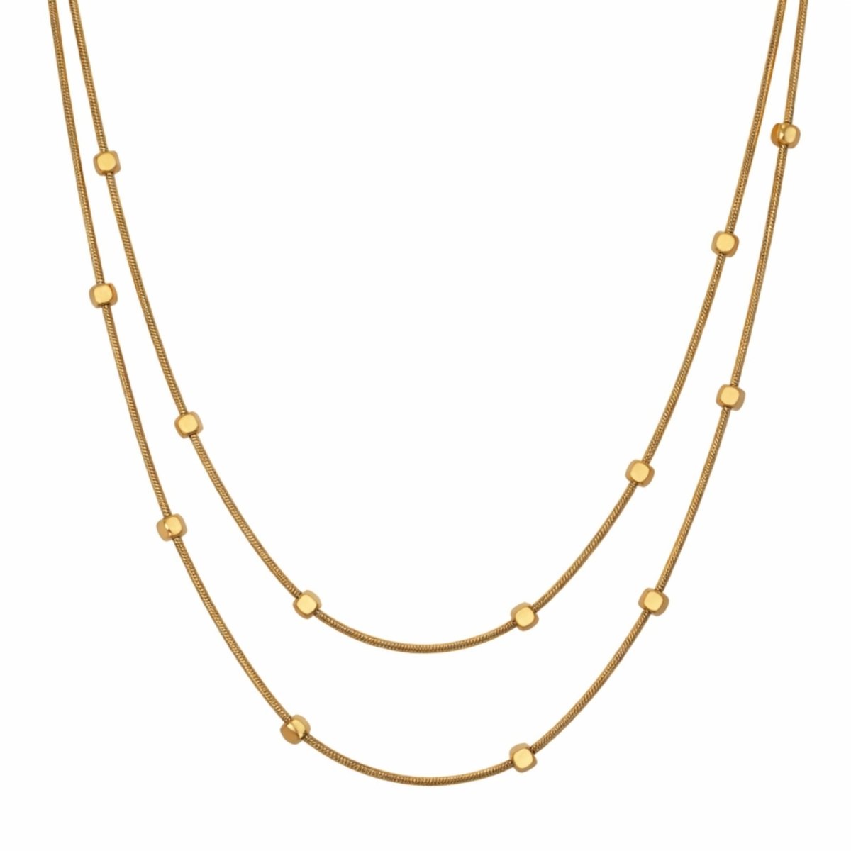 Kouvr Celine double layer gold station necklace with cube beads on a white background.
