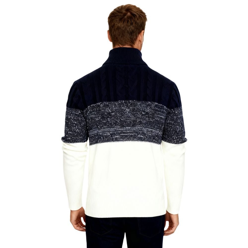 Man wearing a black and white kouvr sweater with a patterned yoke on a white background