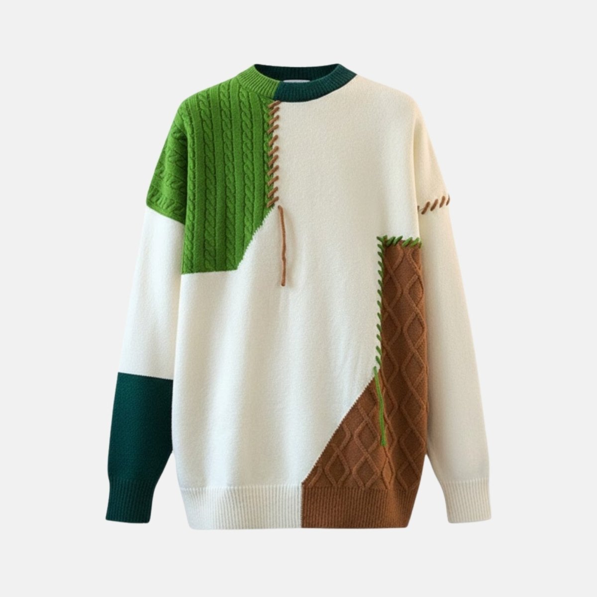 Product shot of the Kouvr patchwork sweater showing the front. Detailed view of the cable knit green panel, diamond knit brown panel, and contrast stitching.