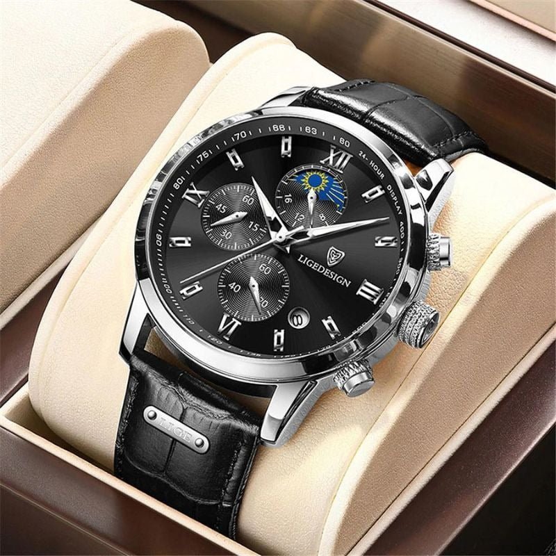 Kouvr Dexter Chronograph watch with a black dial and silver case, displayed in its luxury presentation box.