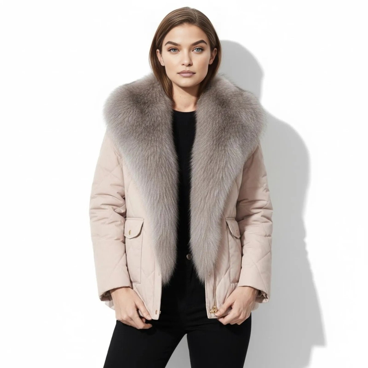 Model wearing Kouvr Fashion's apricot quilted jacket with a large grey fox fur collar, facing front against a white background.