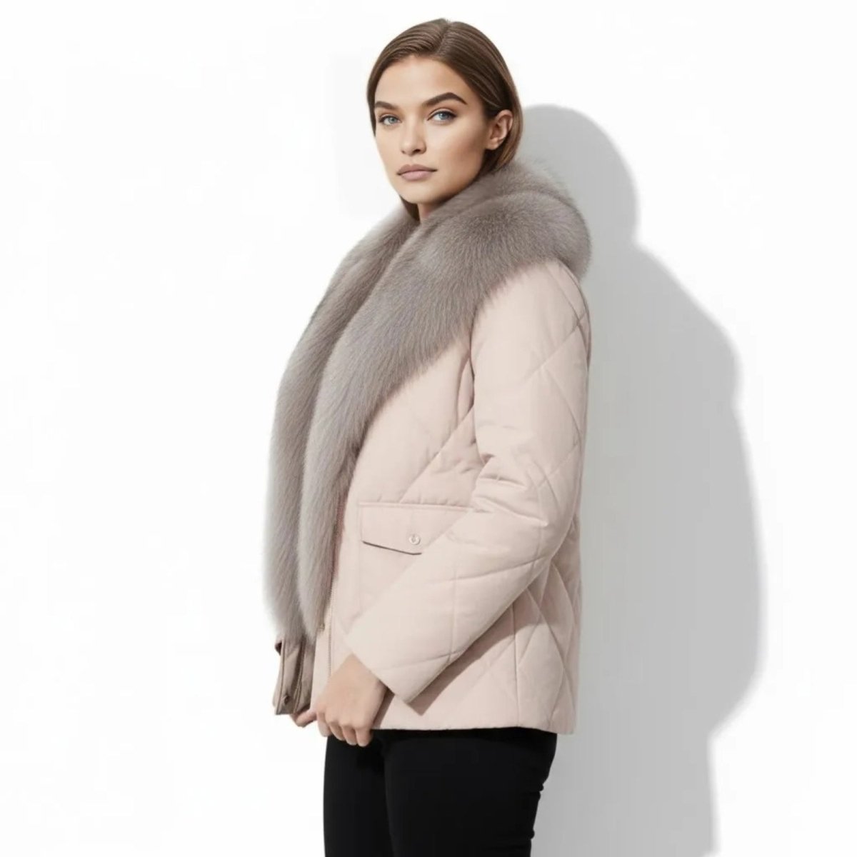 Side profile of a model in a apricot quilted jacket featuring a prominent fox fur collar and cinched waist detail.