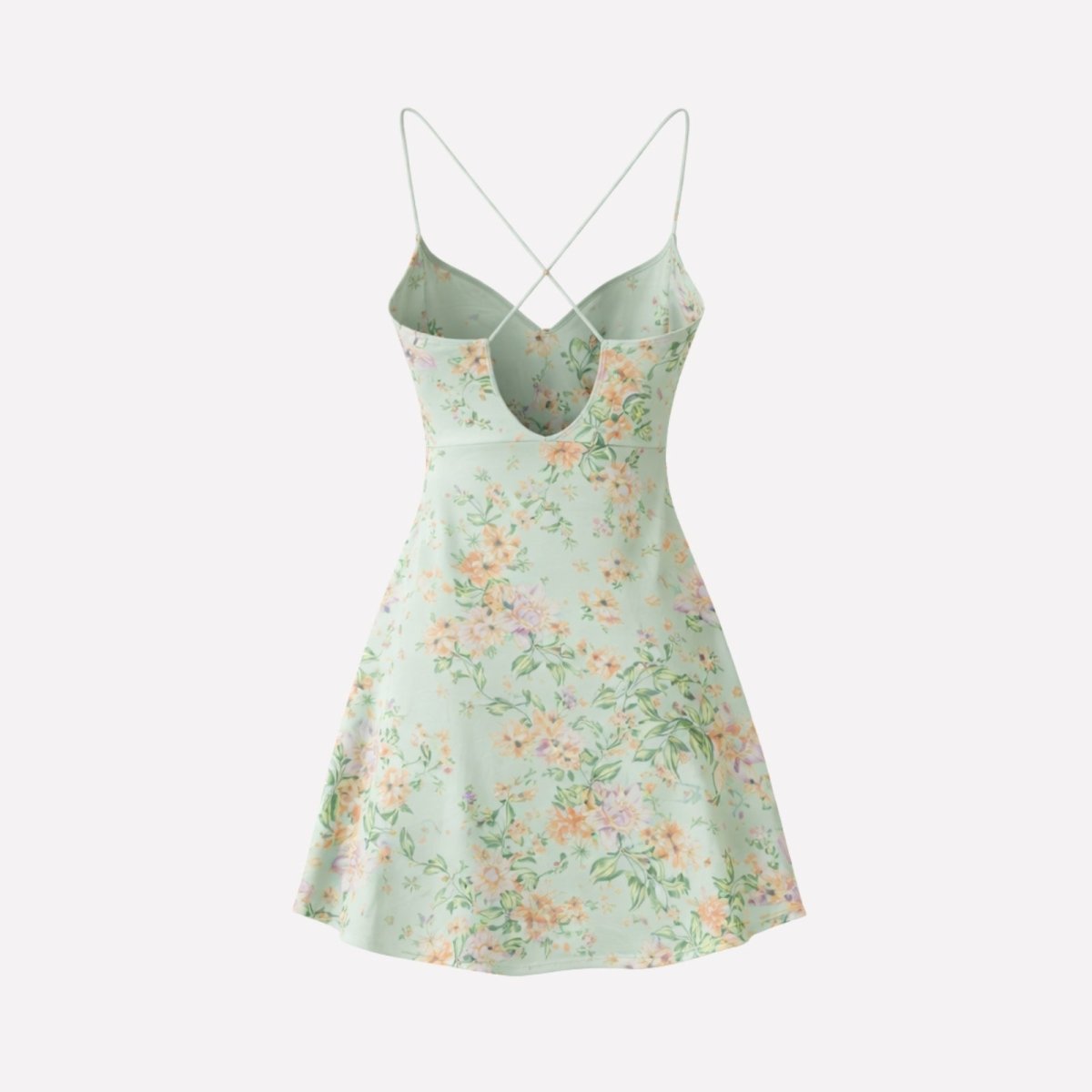 Flat lay of the back of the Kouvr Fashion Ariadne light green floral dress, displaying the criss-cross strap design.