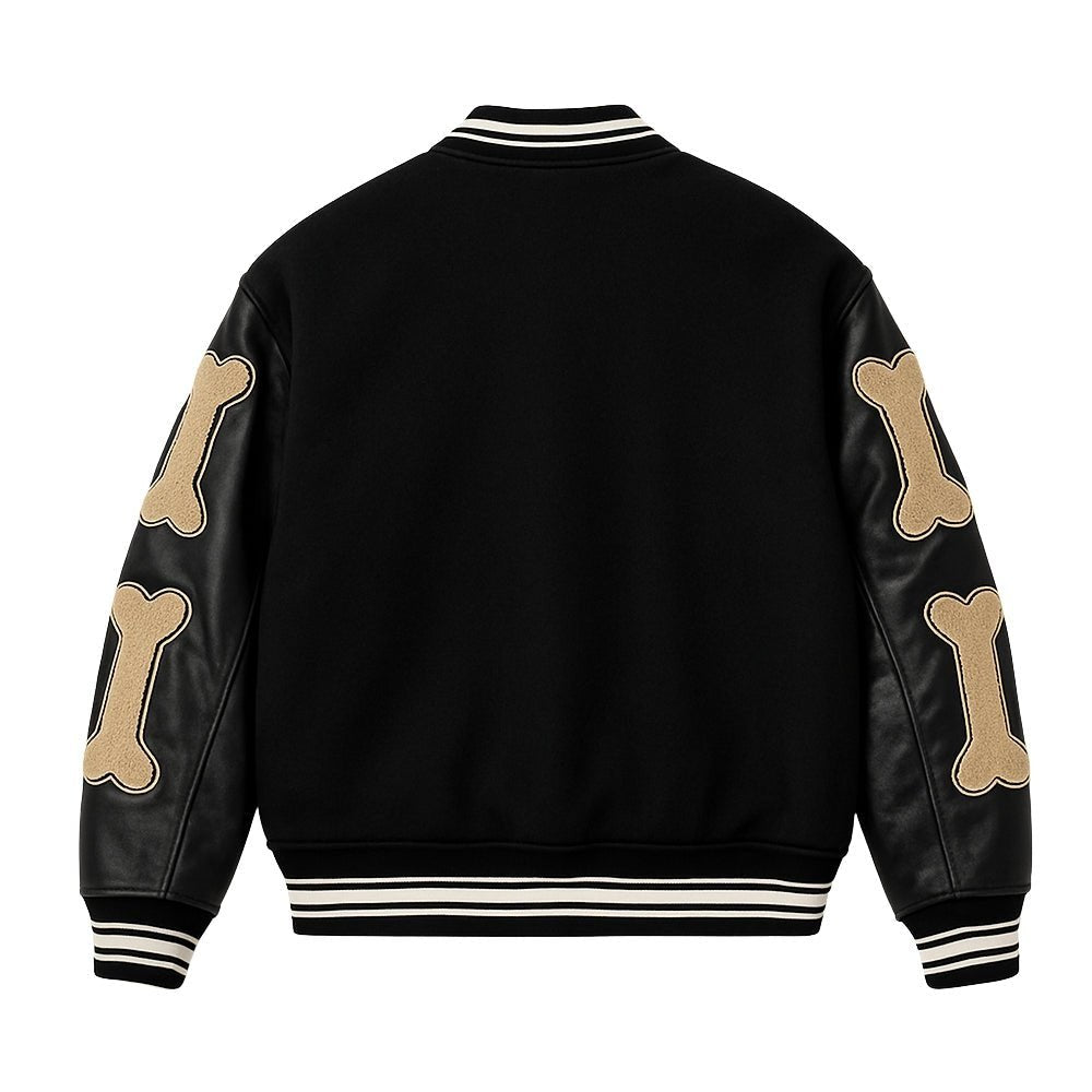 Black Kouvr jacket with beige bone patterns on sleeves and white stripes on cuffs and hem against a white background