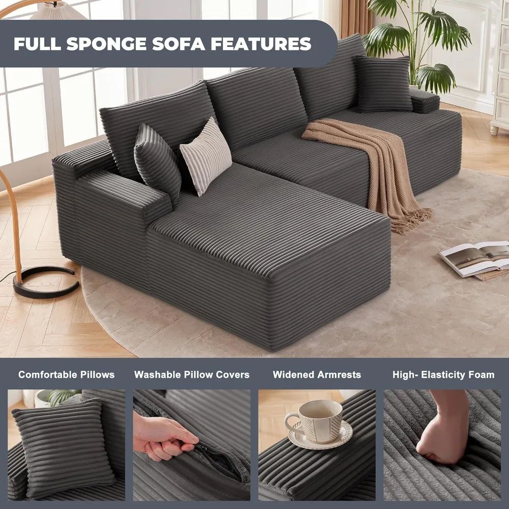 Kouvr modular deep seat sofa in black and dark grey corduroy shown in an L-shape with a beige throw blanket