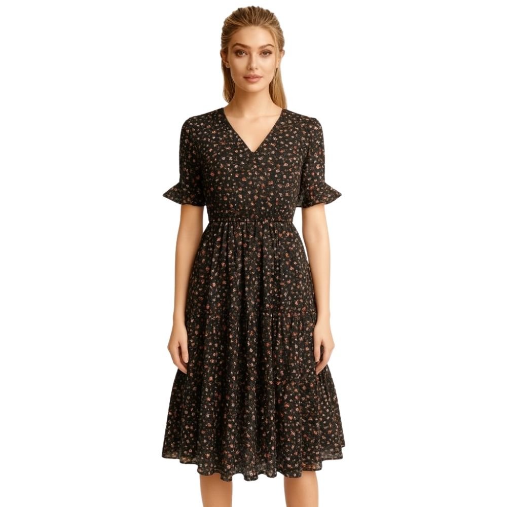 Woman wearing a kouvr black floral dress on a white background