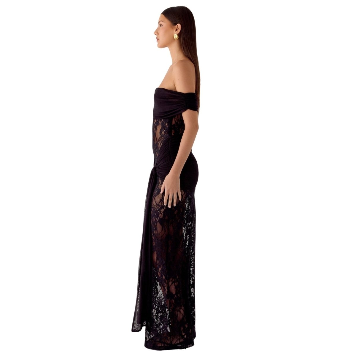 Woman wearing a black Kouvr lace off-shoulder gown on a white background