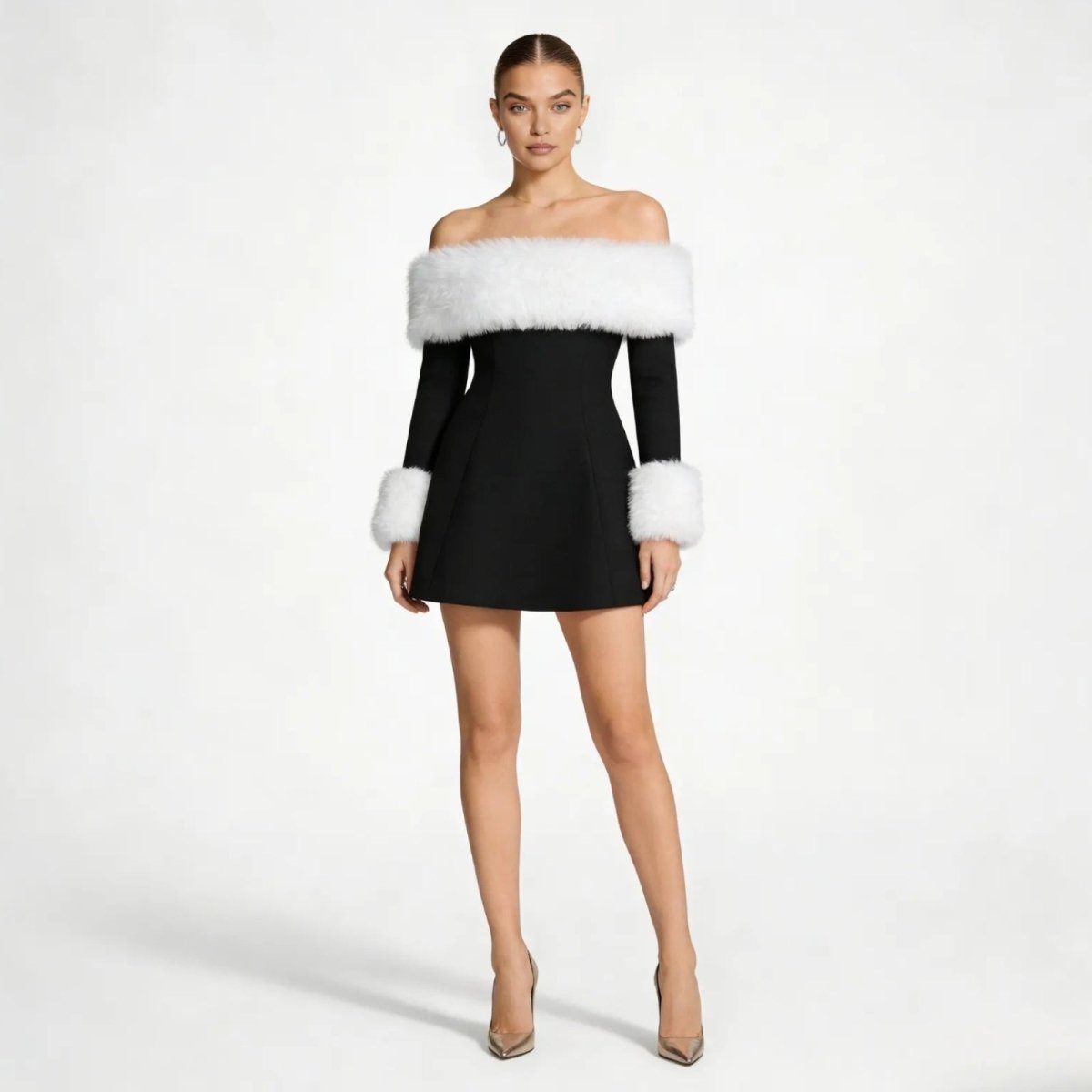 Model wearing the Kouvr Fashion black off-the-shoulder mini dress with white faux fur trim on the neckline and cuffs, shown from the front.