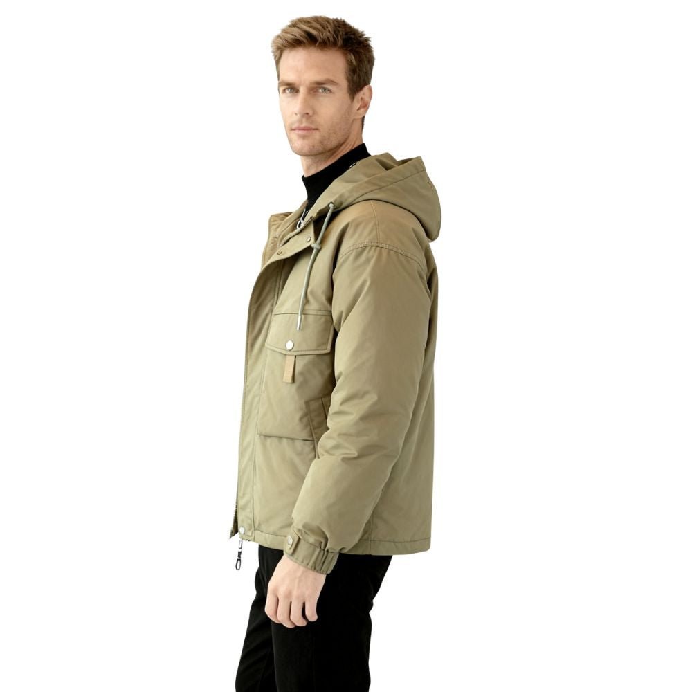 Man wearing a green kouvr jacket with a hood on a white background