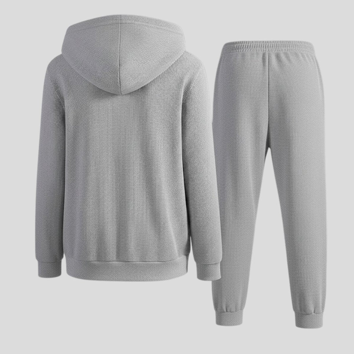 Rear view flat lay of the Kouvr Fashion grey waffle-knit hoodie and joggers, displaying the back design and fabric texture in detail.