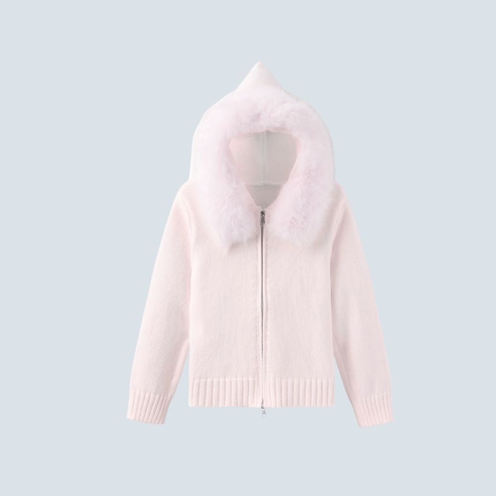 Woman wearing the Kouvr ivory knit hoodie with plush faux fur trim, styled with matching wide-leg pants