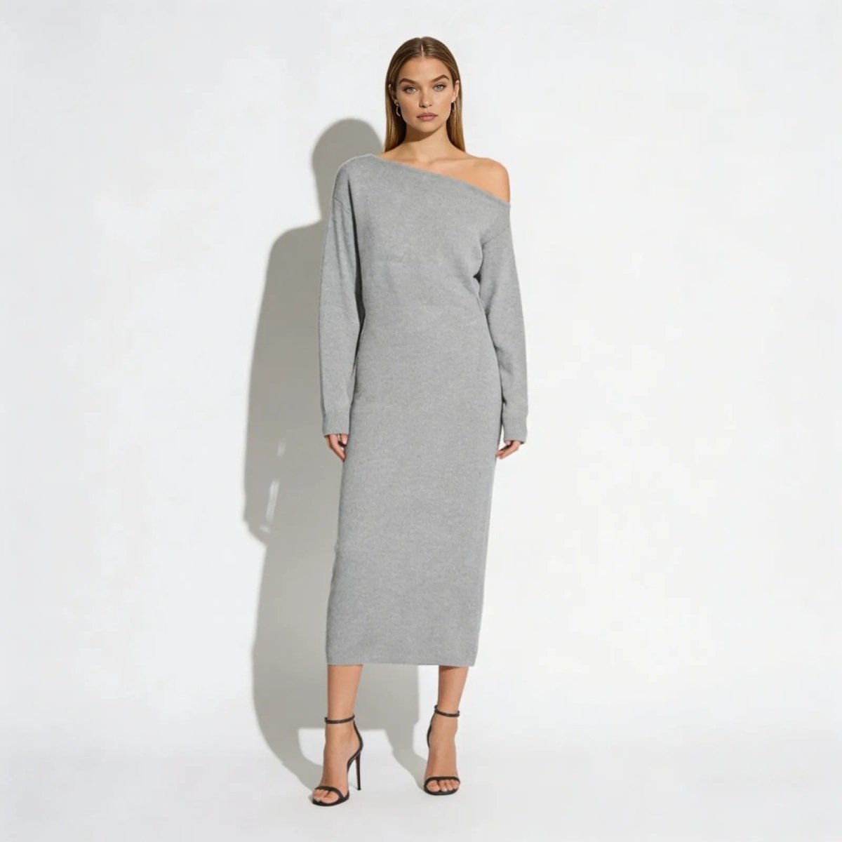 Model wearing the Selena heather grey off-shoulder knit midi dress from Kouvr Fashion, front view.