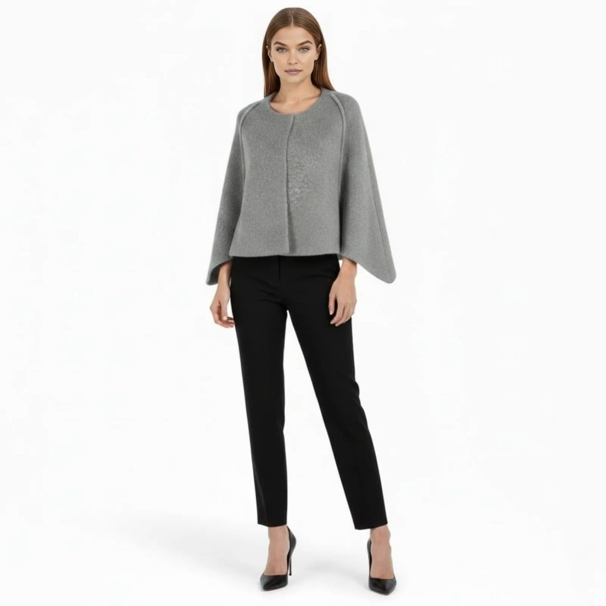 Model wearing the Kouvr Fashion grey wool blend structured cape jacket with black trousers and heels, front view.