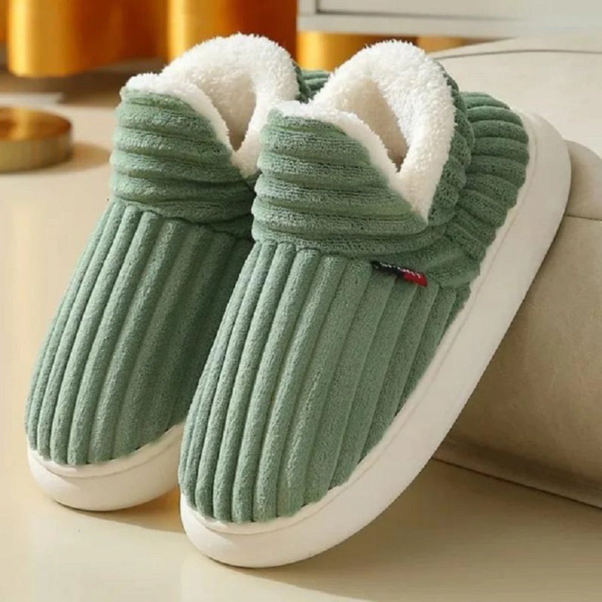 A pair of Light Green Jasmine corduroy slipper boots by Kouvr Fashion, highlighting the wide-wale texture and plush sherpa collar.