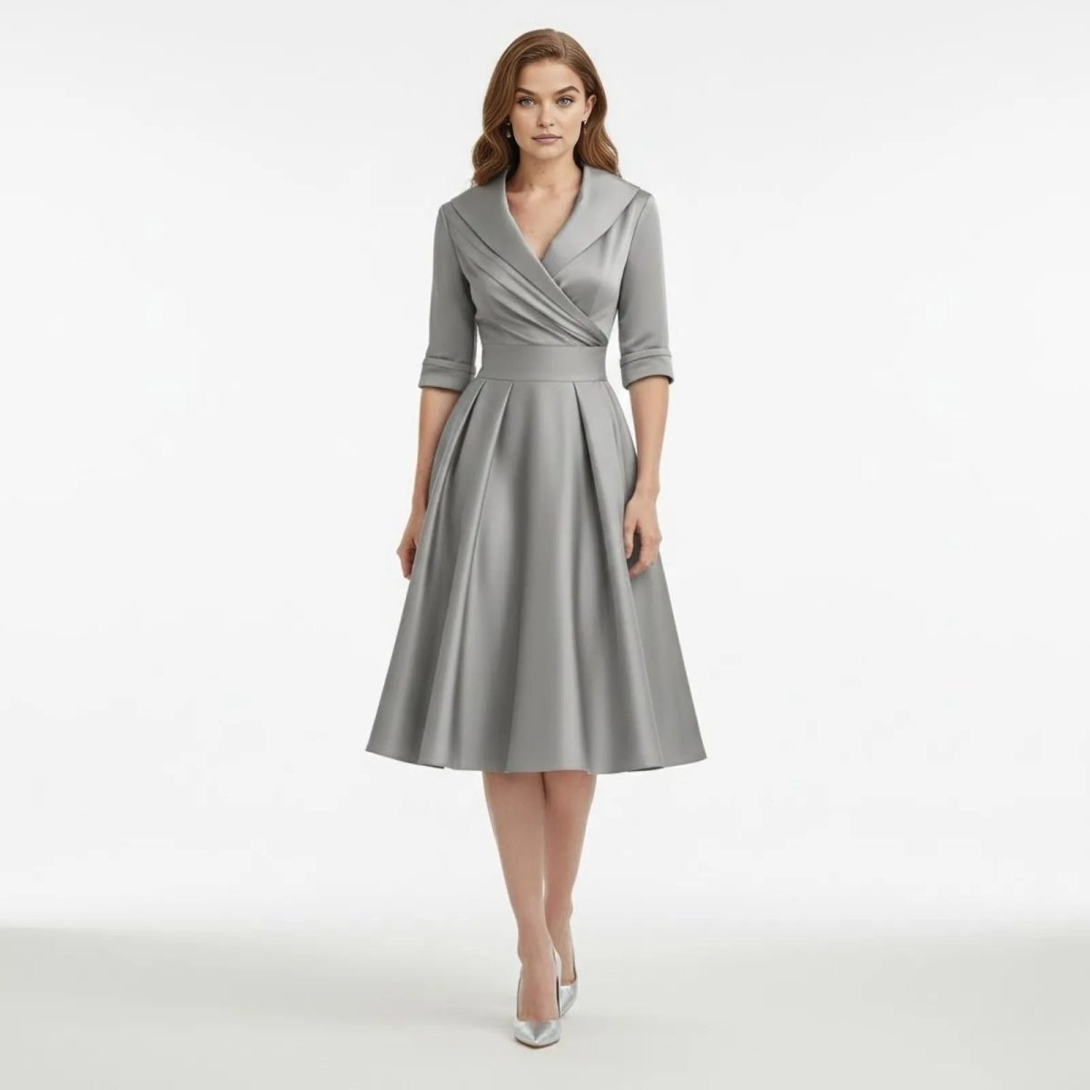 Model wearing the Kouvr Fashion Jenner grey satin midi dress with a shawl collar, shown from the front on a white background.