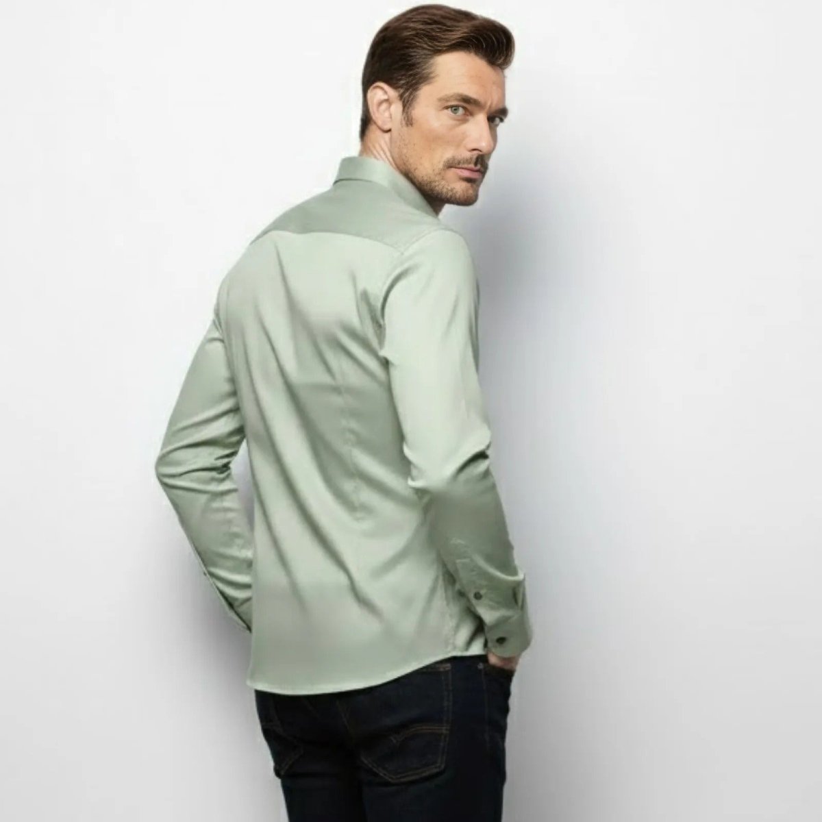 Back view of the Kouvr Fashion Light Green Men's Shirt, showing the back yoke and shaping darts that create a tapered silhouette.