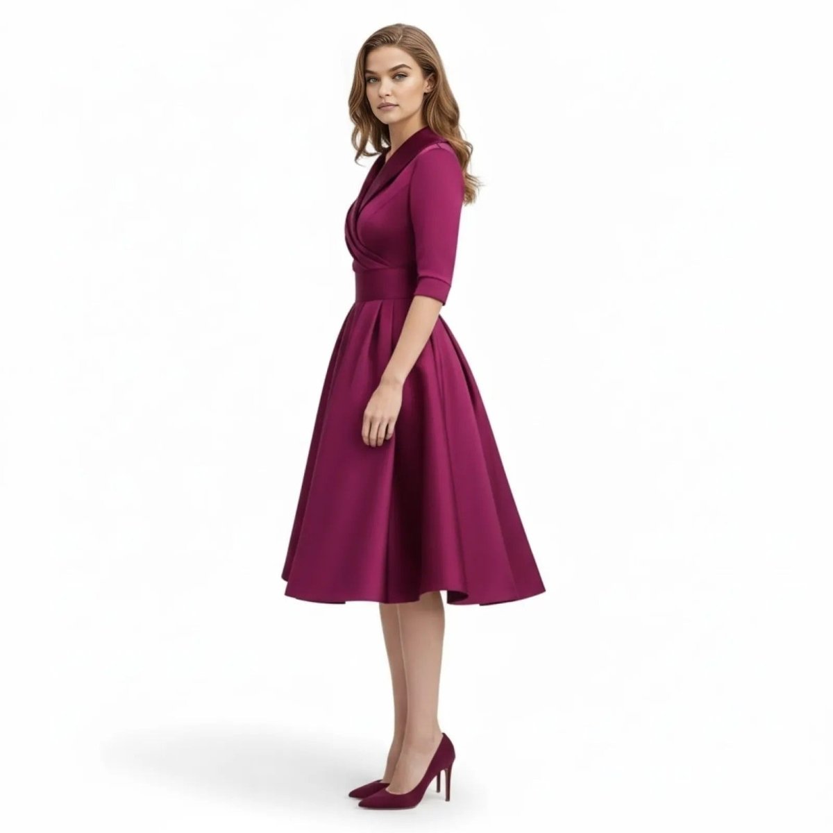 Side profile of a model in the Kouvr Fashion magenta A-line cocktail dress, showing the flow of the pleated satin skirt.