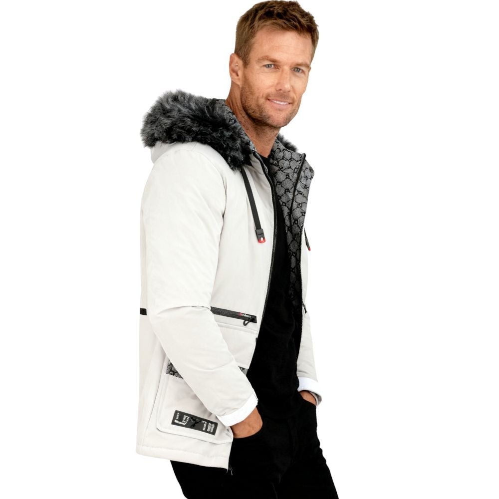 Man wearing a white kouvr jacket with a fur-lined hood on a white background