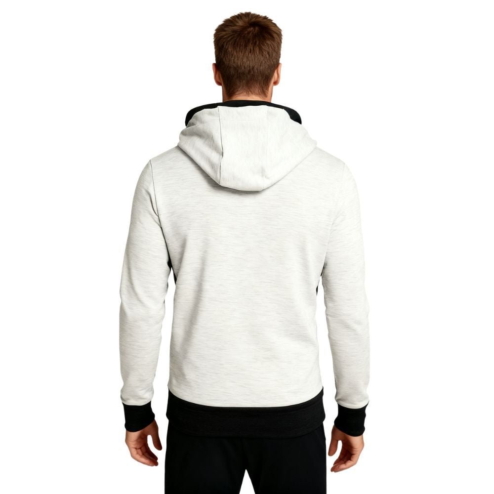 Person wearing a white kouvr hoodie with black cuffs and hem on a white background