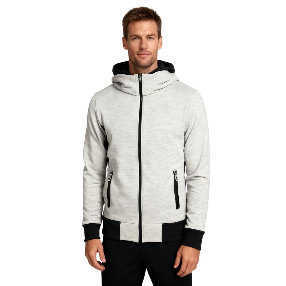 Man wearing a beige kouvr hoodie with black accents on a white background
