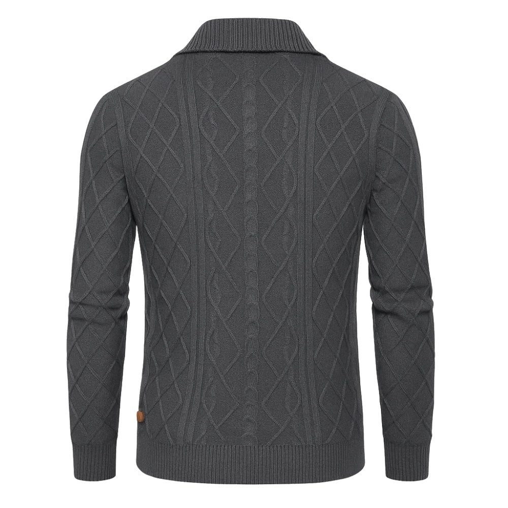 Gray kouvr cable knit sweater on a white background