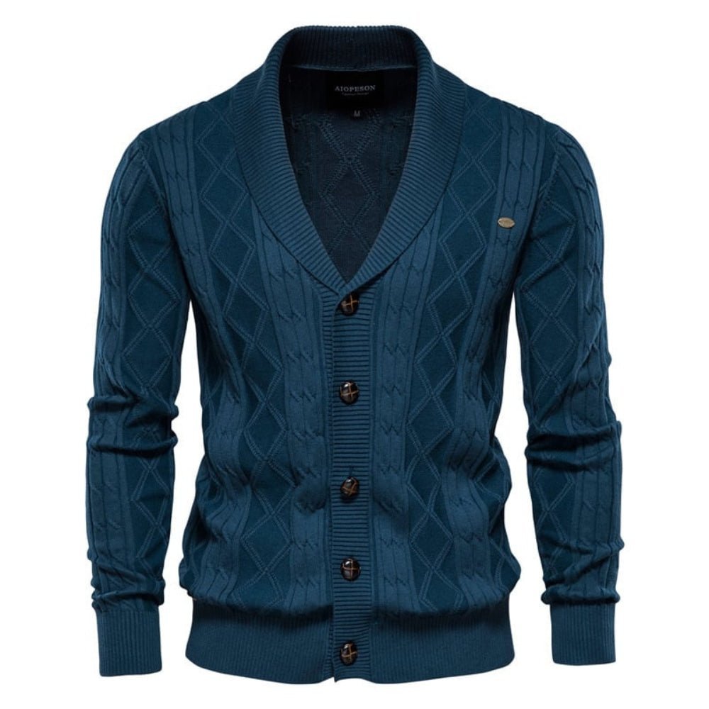 Blue kouvr cable knit cardigan with button details on a white background