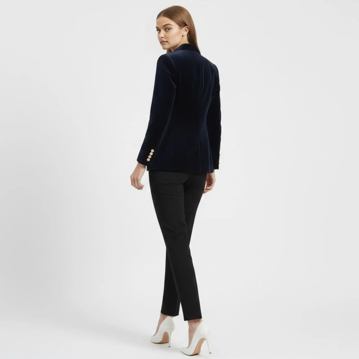 Back view of the Kouvr Fashion navy blue single-breasted velvet blazer, showing the structured tailoring and back vent.