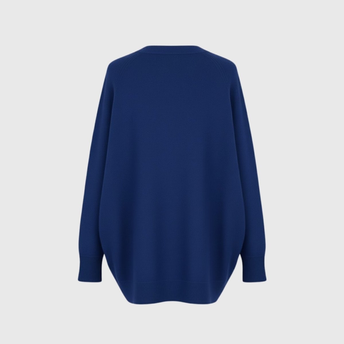 Product-only studio shot of the back of the Kouvr Fashion oversized crewneck sweater in cobalt blue, detailing the neckline and knit quality.