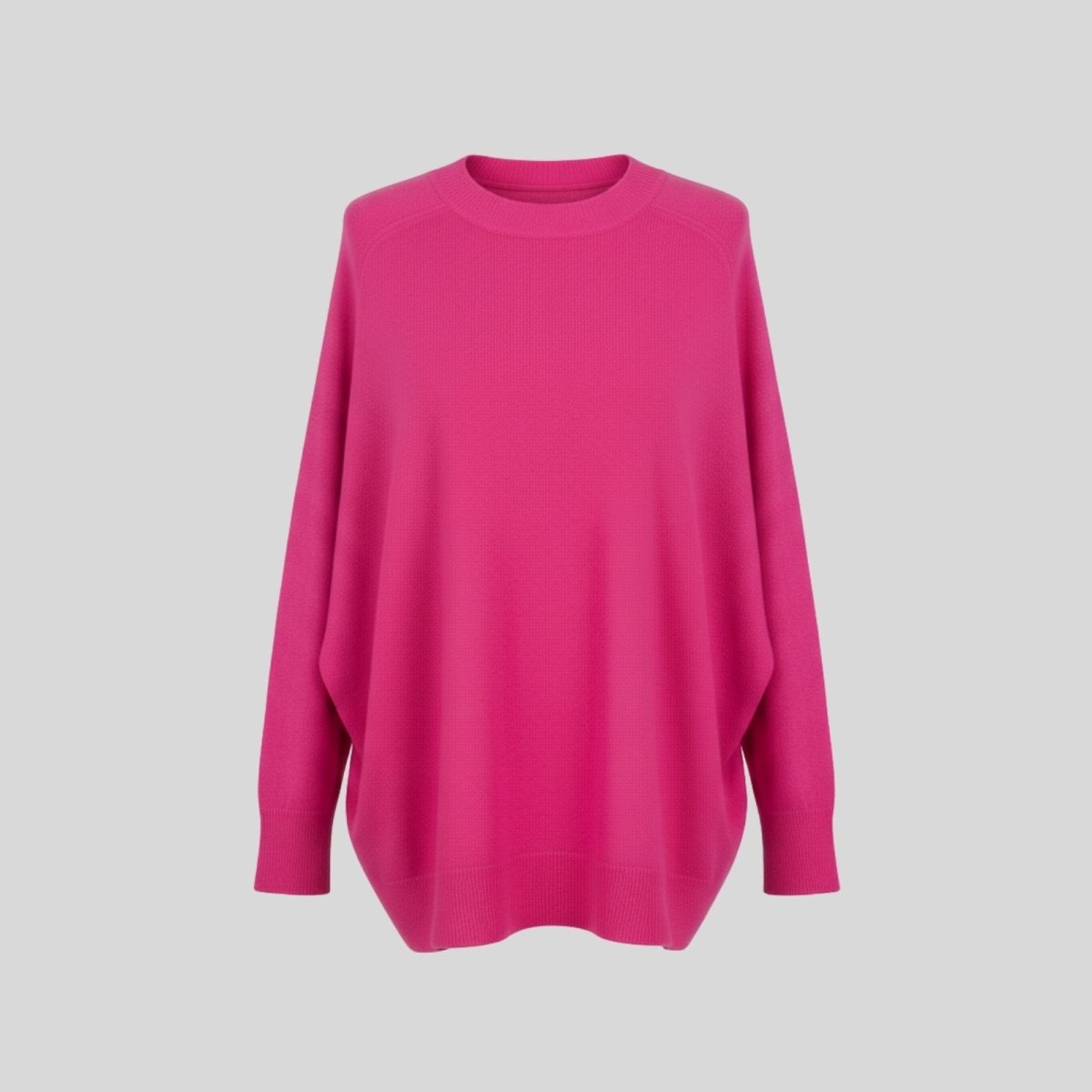 Front product shot of the Kouvr Fashion fuschia pink oversized cashmere wool blend sweater on a light grey background.
