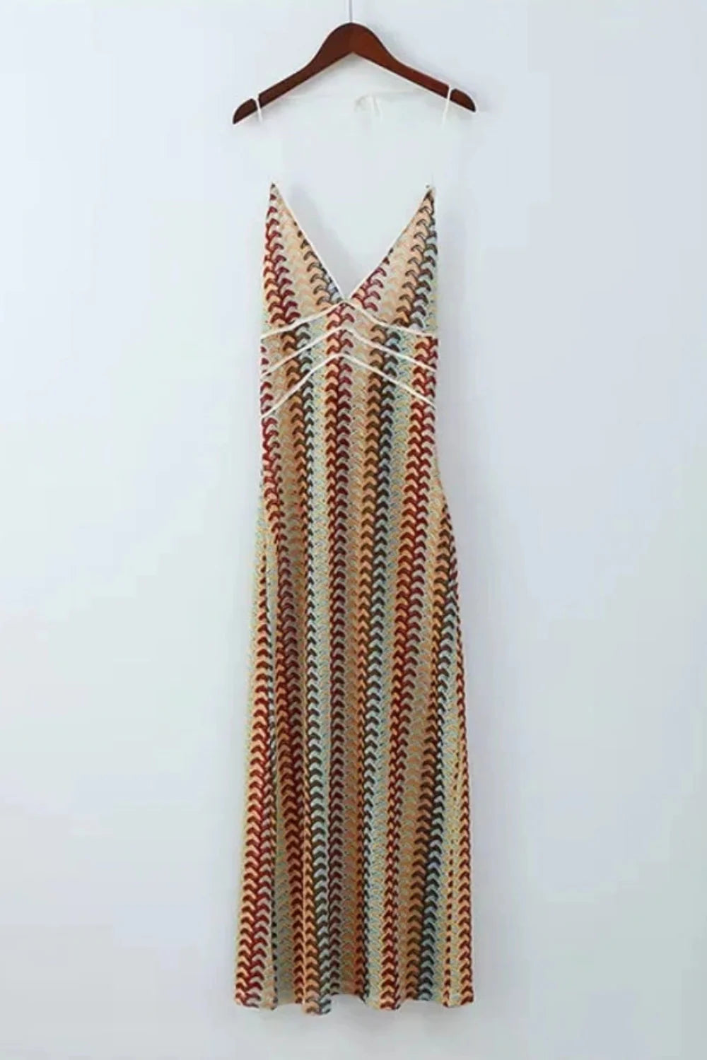 Model viewed from the back wearing the Kouvr Fashion 70s-inspired retro wave print halter maxi dress, showcasing the open-back design