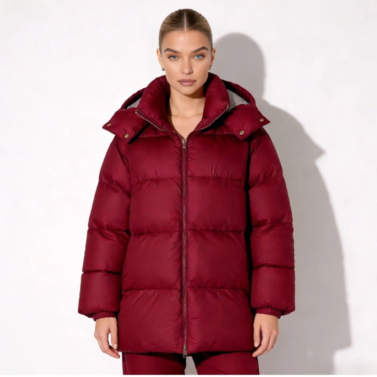 Model wearing the Kouvr Fashion Sheena oversized down puffer jacket in a burgundy, shown from the front against a white background.