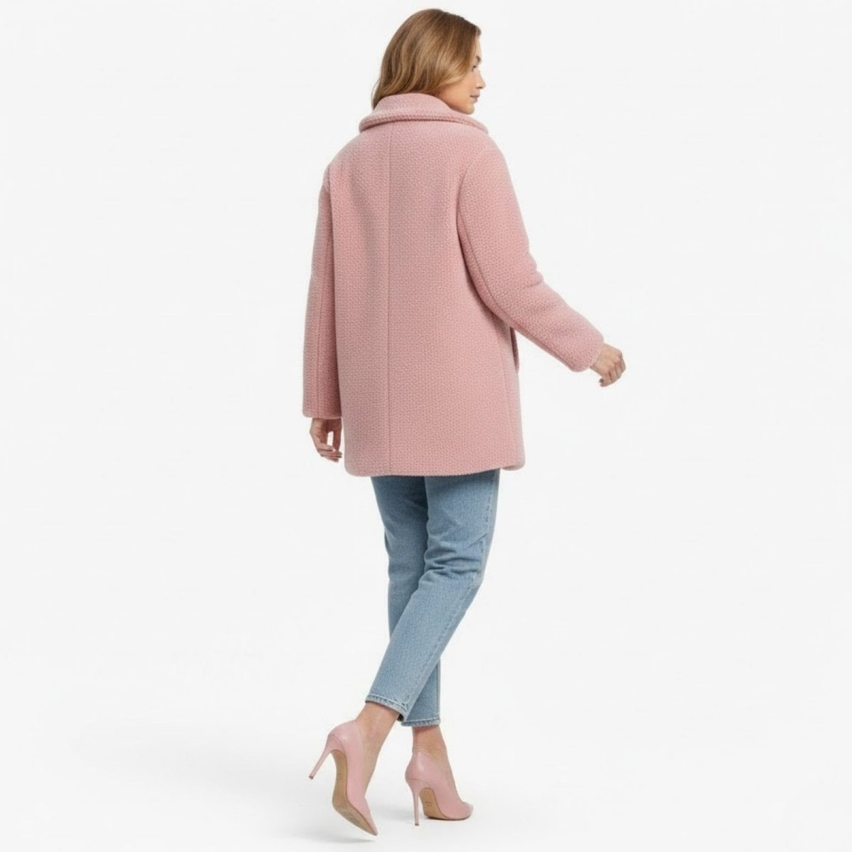 Back view of the Kouvr Fashion pink teddy coat, showing the clean lines, tailored back panel, and luxurious faux shearling fabric.