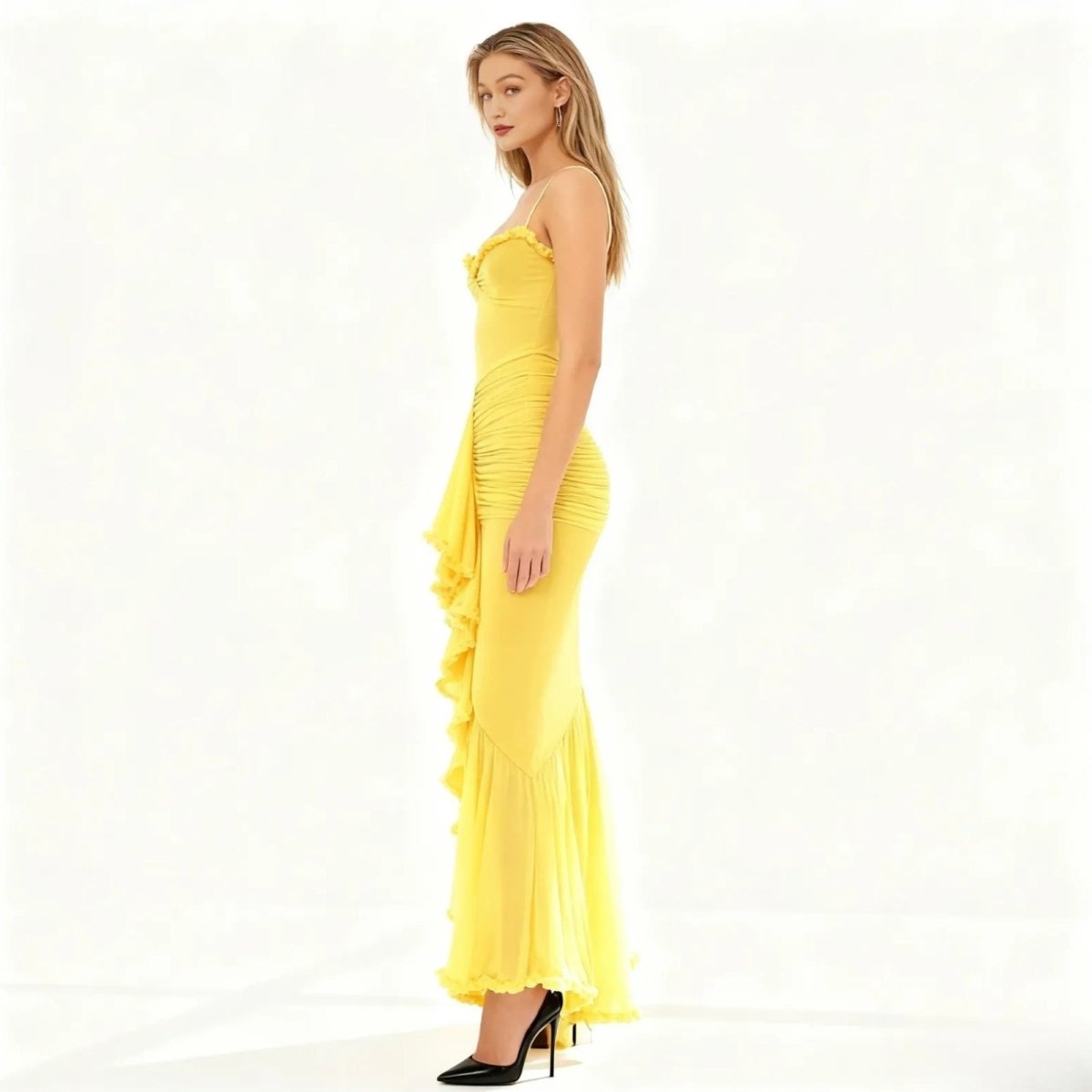 Woman wearing a yellow evening gown on a white background