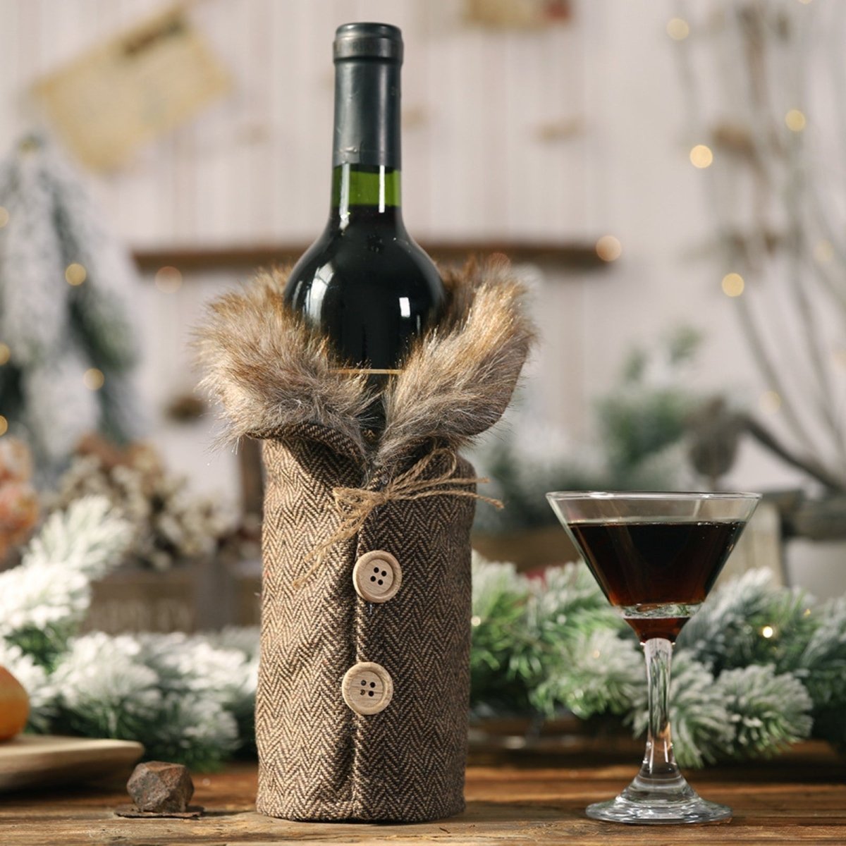 Overhead shot showing the rich texture and detail of the plush faux fur collars on the Kouvr Vinter Sartorial wine bottle covers.