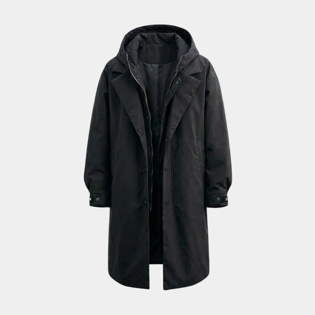 Studio product shot of the black Kouvr Hartley technical coat, open to show the inner zippered layer.