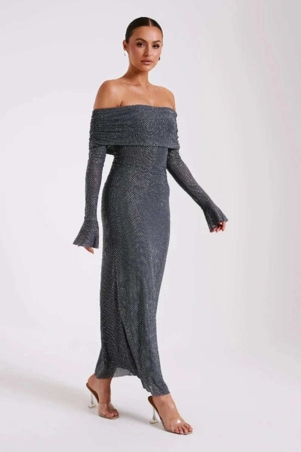 Model wearing Kouvr Jada long sleeve off-the-shoulder evening gown in gray
