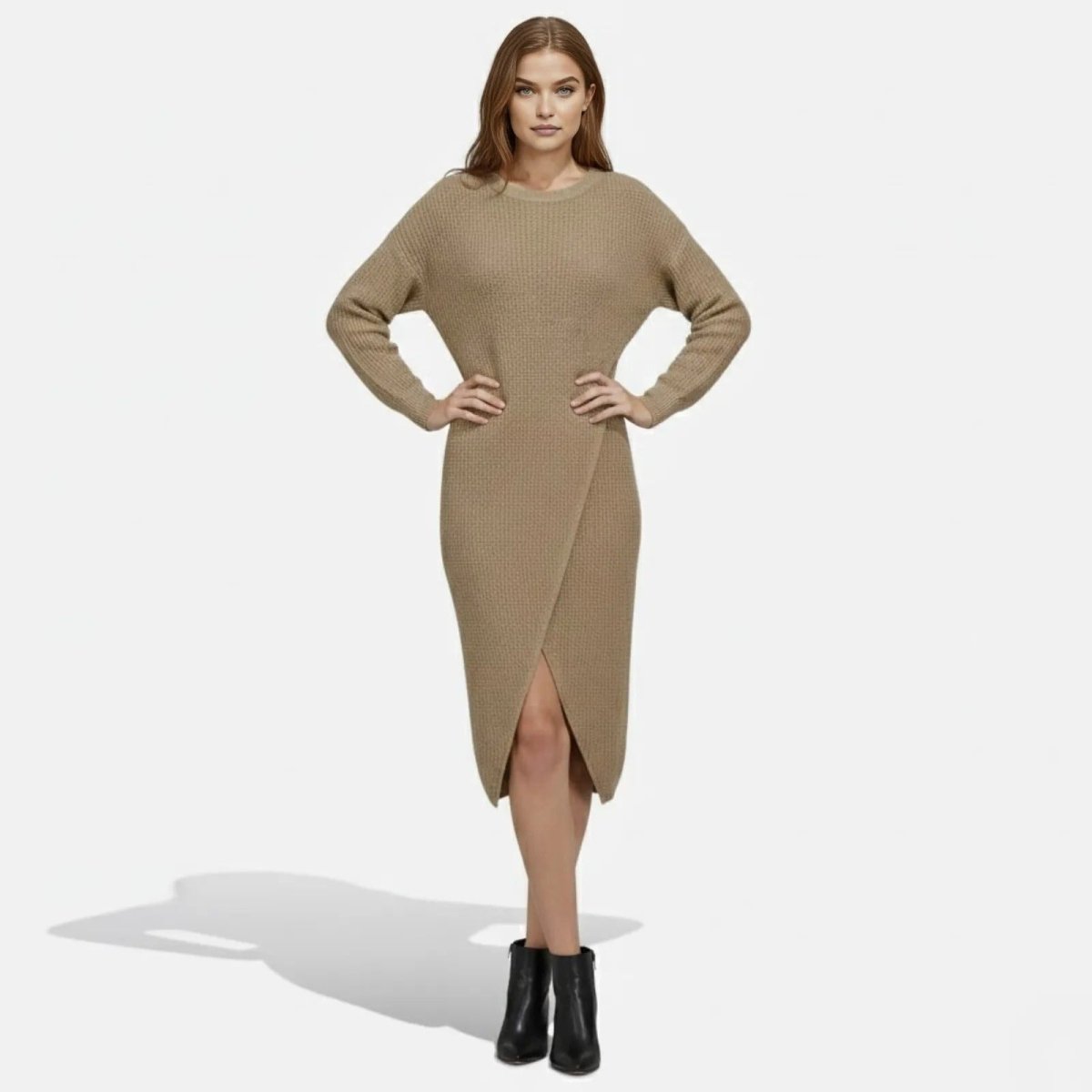Front view of a model wearing the Kouvr Janessa long-sleeve khaki wrap knit midi dress with hands on hips.