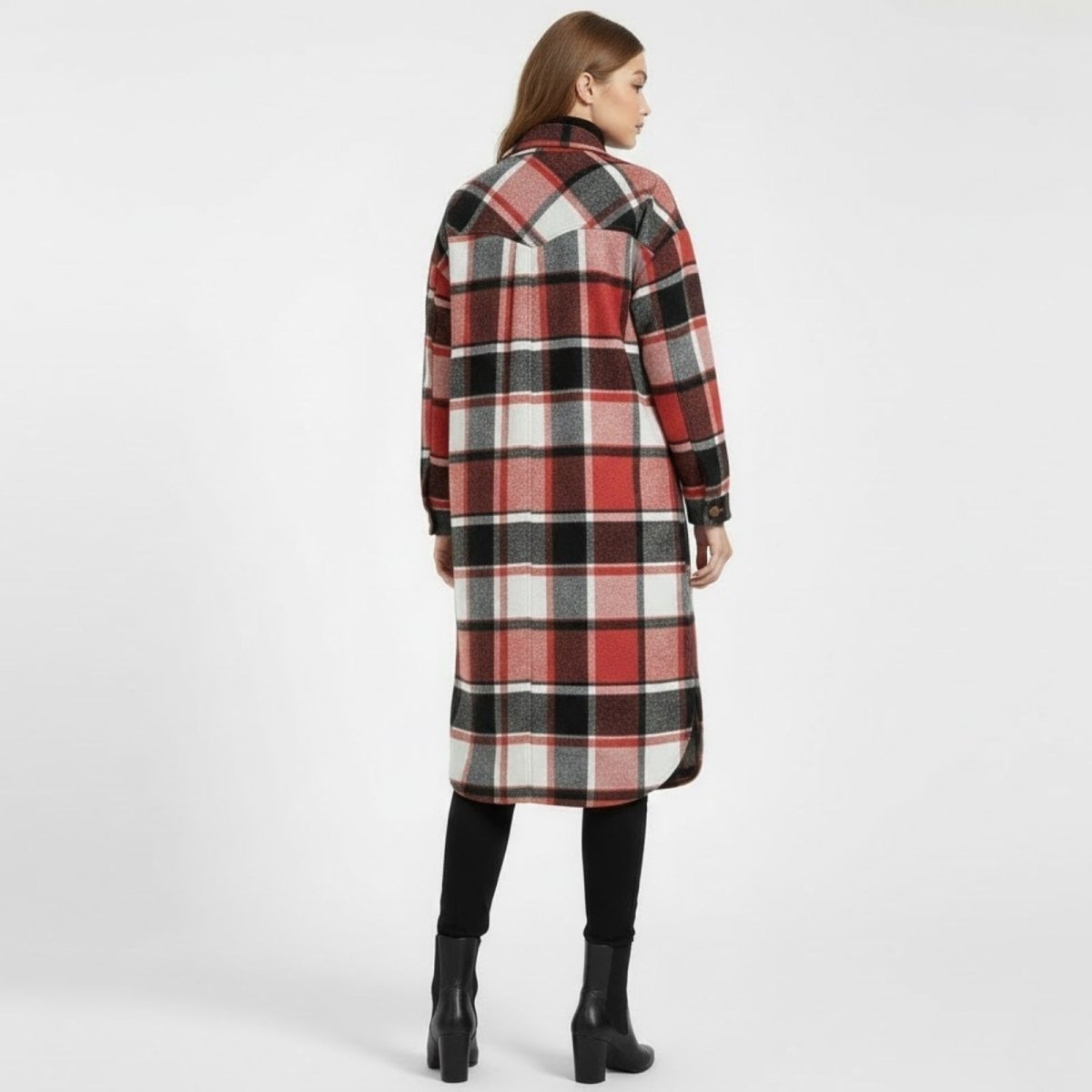 Rear view of a model wearing the Janet long plaid shacket, displaying the back yoke detail and the full red, black, and white check pattern.