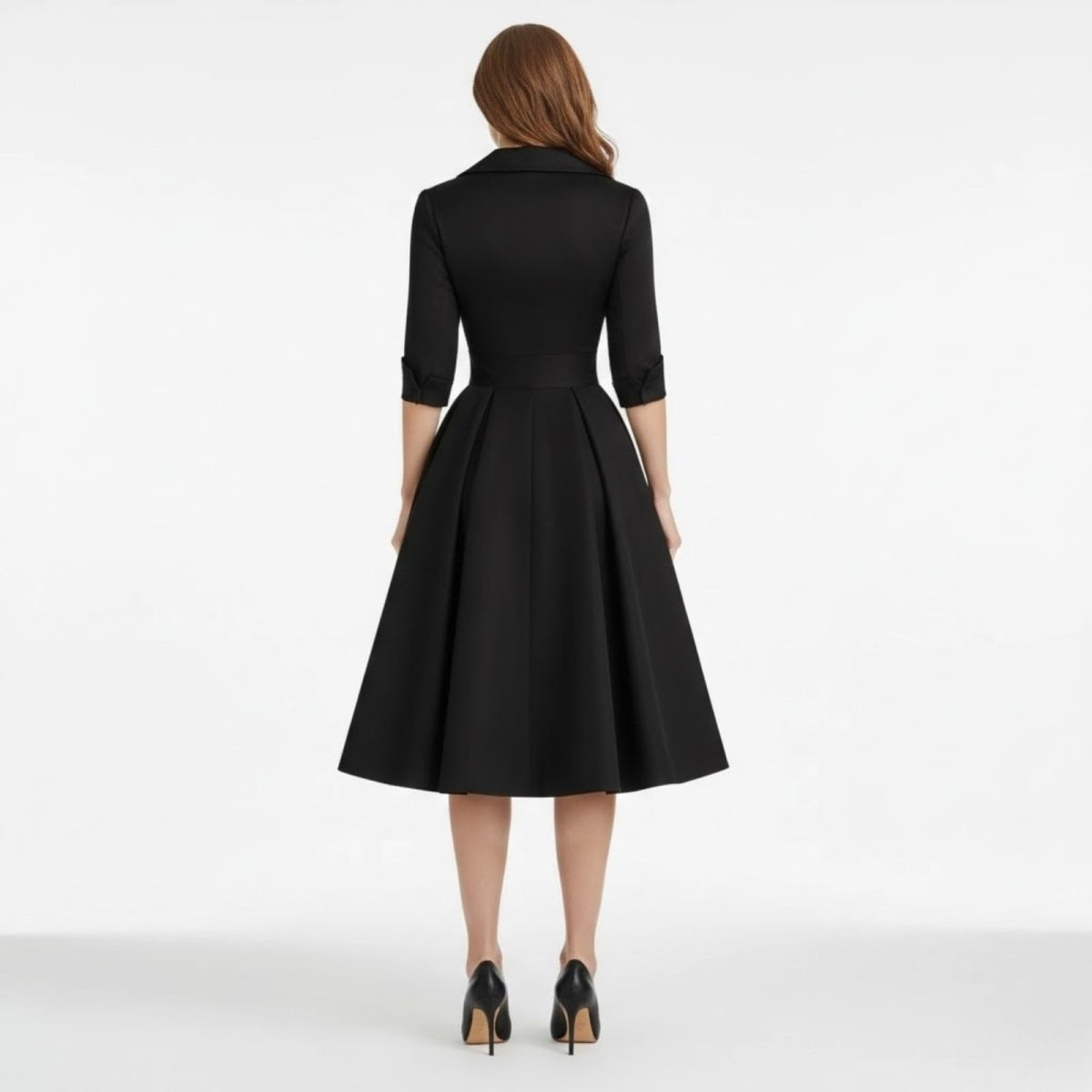Back view of the Kouvr Jenner black dress, showing the tailored fit of the bodice and the concealed zipper detail.
