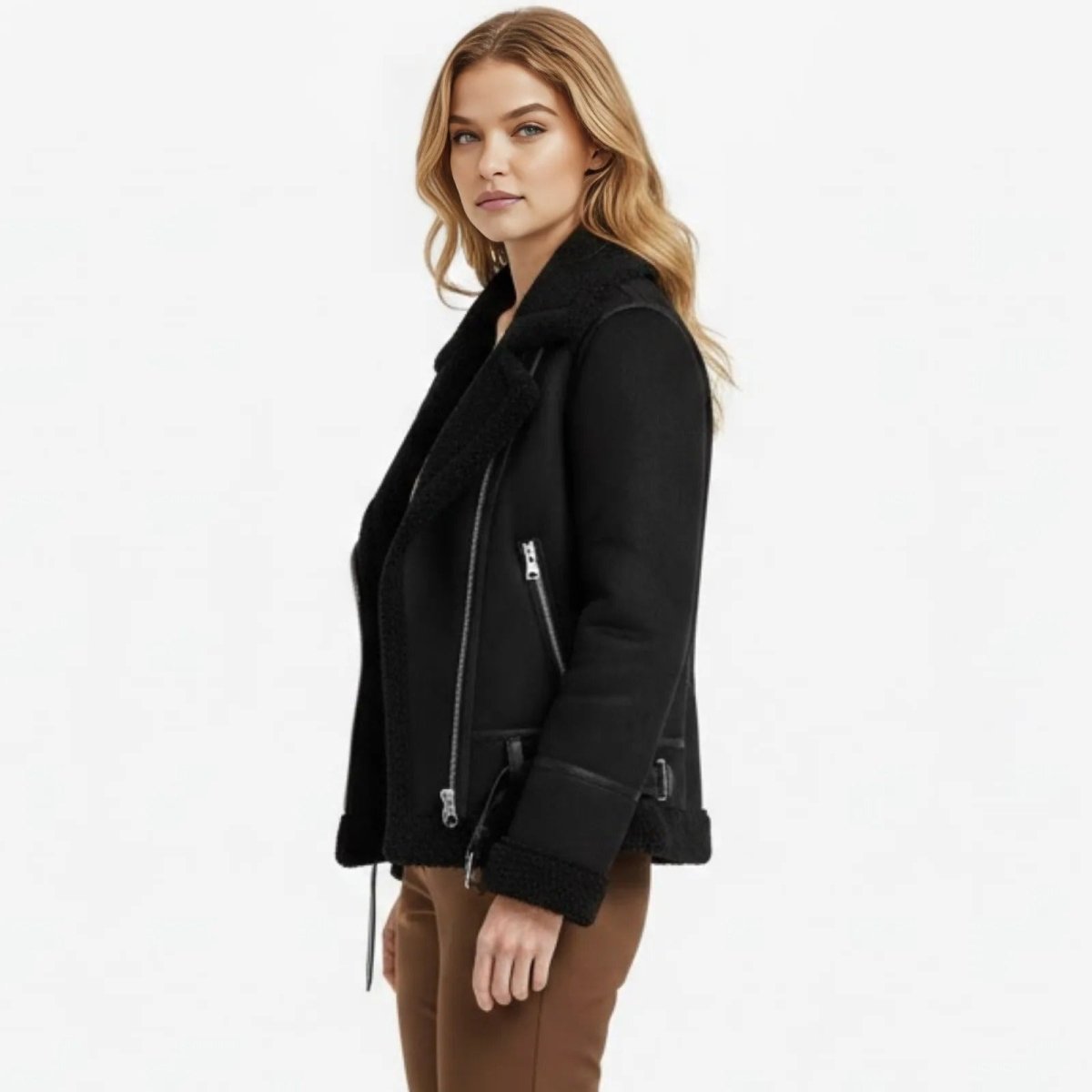 Side profile of a model in the Kouvr Katelynn black faux leather moto jacket, showing its oversized collar and relaxed fit.