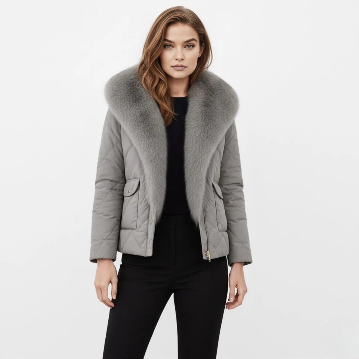 Woman wearing the Kayla grey quilted jacket with a large fox fur collar, shown from the front against a white background.